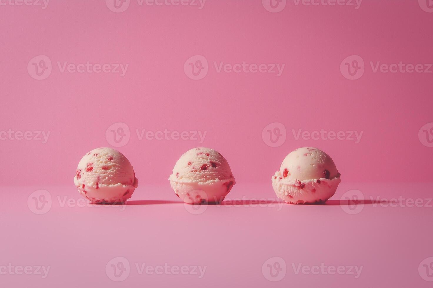 Ice cream scoops against pastel pink background, minimal summer food concept photo