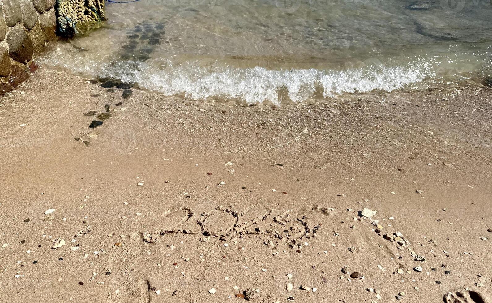 Year 2025 Written in Sand. Christmas photo