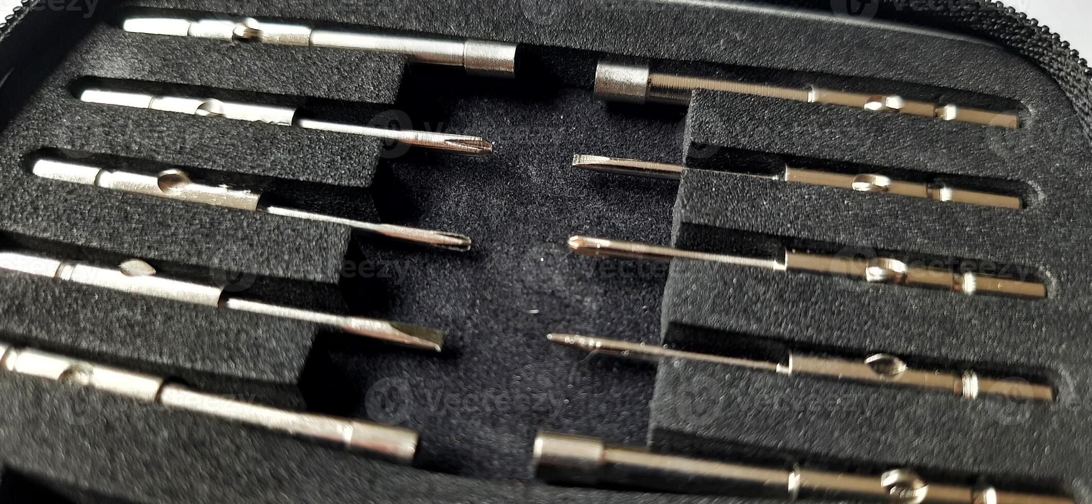 Precision household tool kit. Screwdriver set mini sunglasses. Eyewear repair tools with zipper box. Electronic repair kit photo