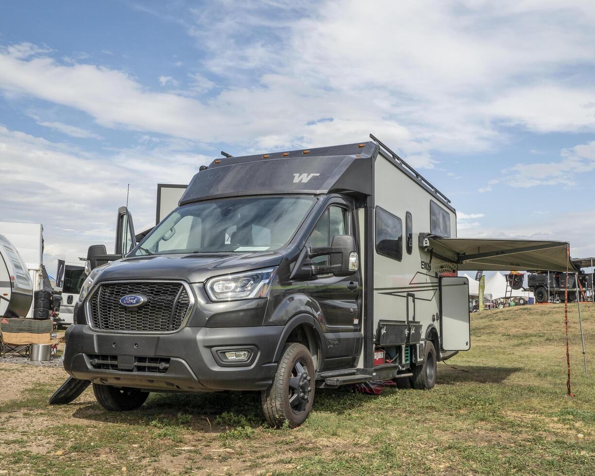 Loveland, CO, USA - August 26, 2022 - Winnebago EKKO camper van, Class C coach, built on Ford AWD Transit Chassis at a busy campground.. photo