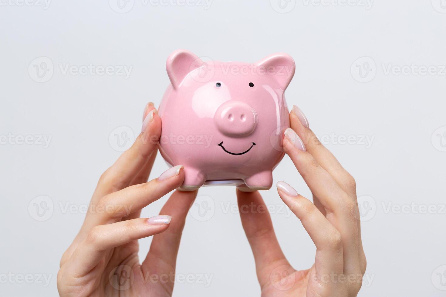 3d pink piggy bank in the beautiful hands of a girl. photo