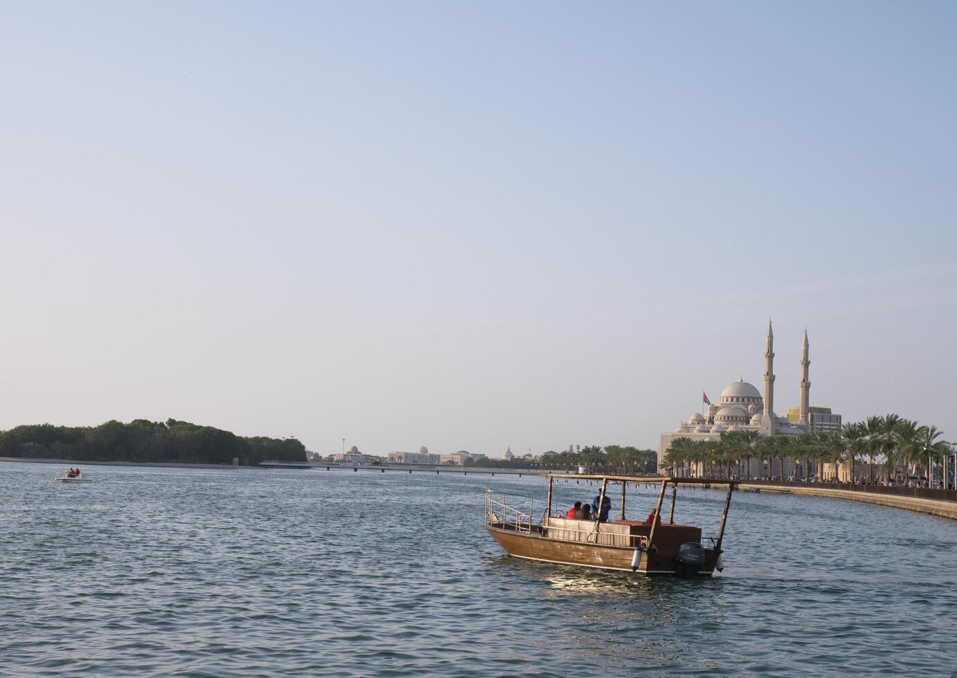 Sharjah, UAE, Feb 14, 2023 Al Majaz Quay, Khaled Lake with Al Noor Mosque in the background. photo