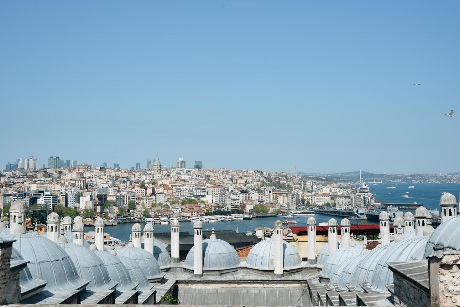 Istanbul, Turkey, May 02, 2023 View from Suleymaniye mosque on the Bosphorus photo