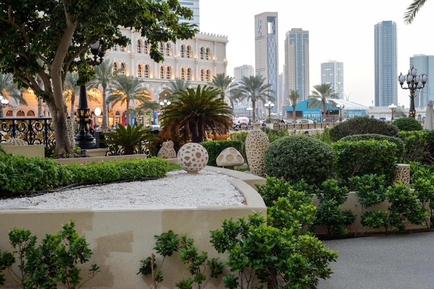 Sharjah, UAE, February 14, 2023 Al-Qasba mall and boats for rent on the Al-Qasba water channel photo