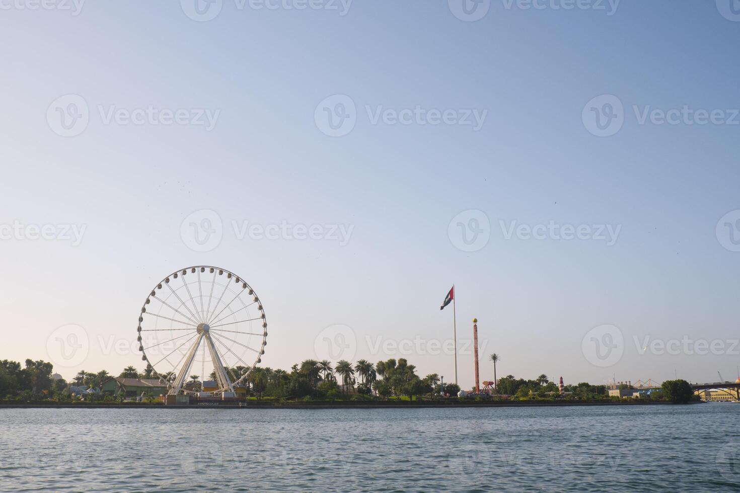 Sharjah cityscape with UAE flag. photo