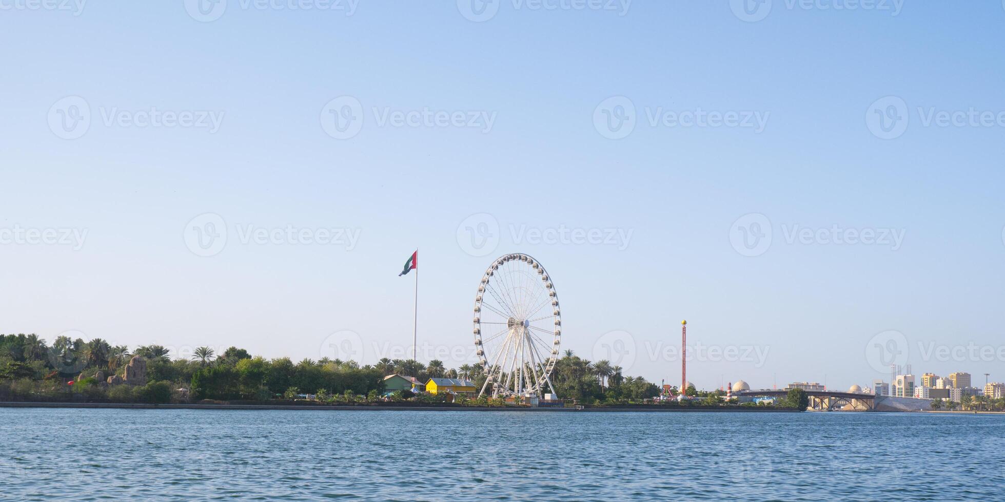 Sharjah cityscape with UAE flag. photo