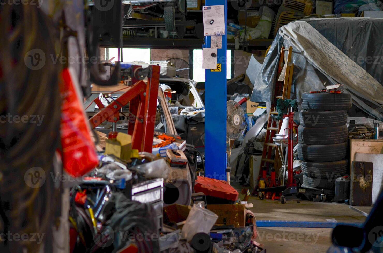 Organized Chaos in an Auto Workshop A Look Inside a Mechanic's Workspace photo