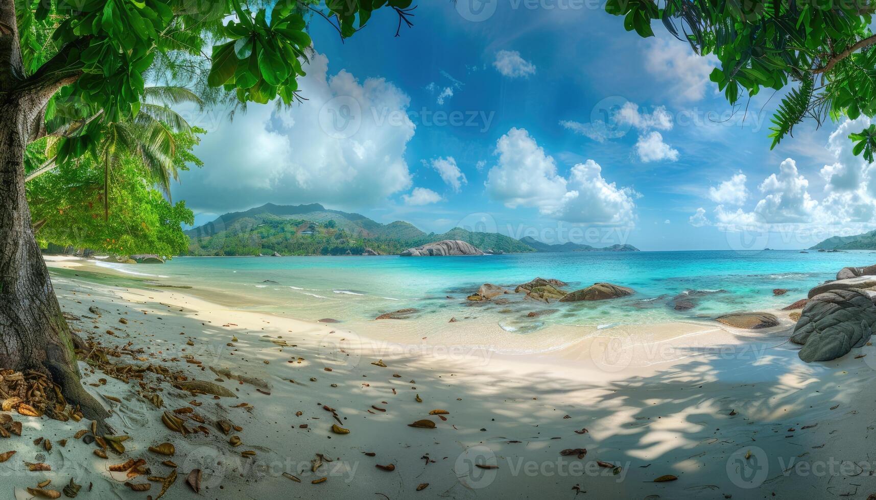 Lush Green Tropical Beach with Crystal Clear Waters and Majestic Mountain Views photo
