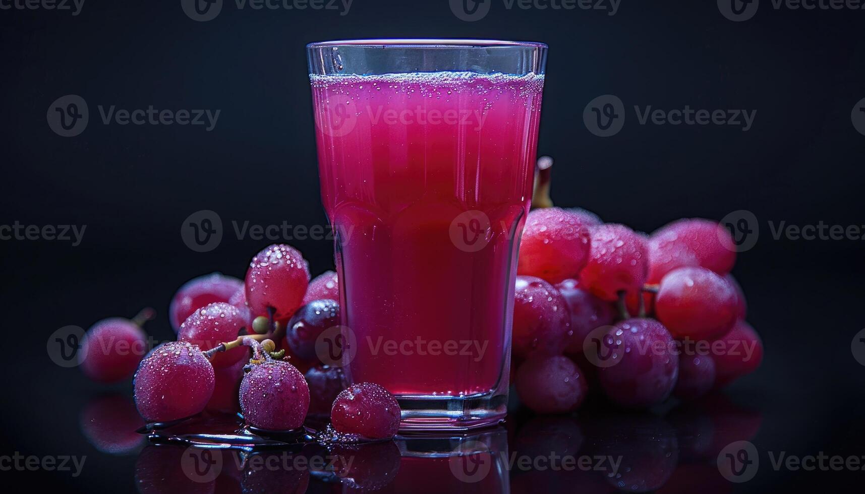 A Glass of Freshly Made Grape Juice with Grapes photo