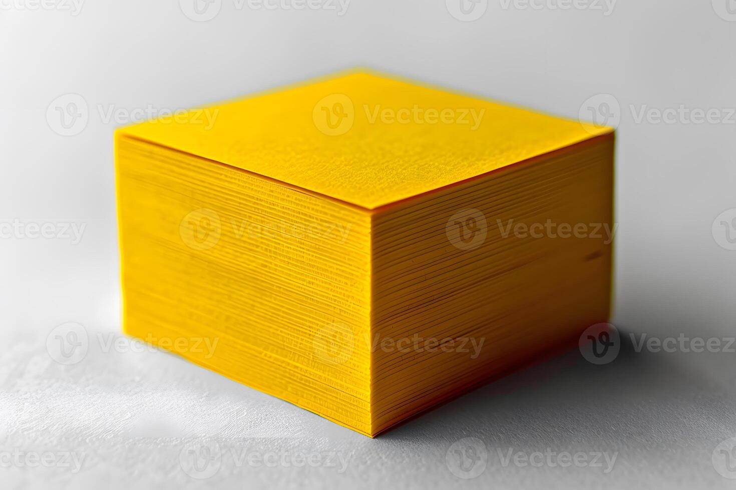 Stack of Bright Yellow Paper Sheets for Office Supply and Stationery Design photo