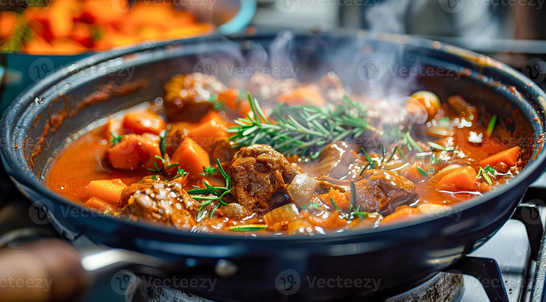 Tasty beef stew with steam on a frying pan ready to be served for family dinner photo