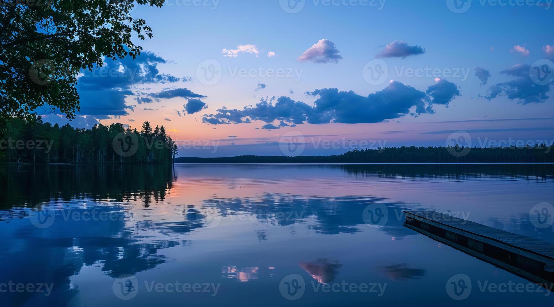 Serene lake dramatic landscape and skies on sunset or blue hour photo