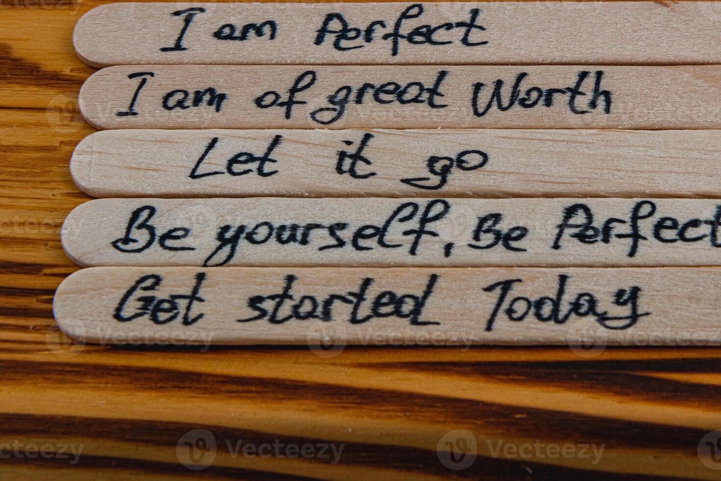 Positive thoughts to increase self esteem on wooden sticks photo