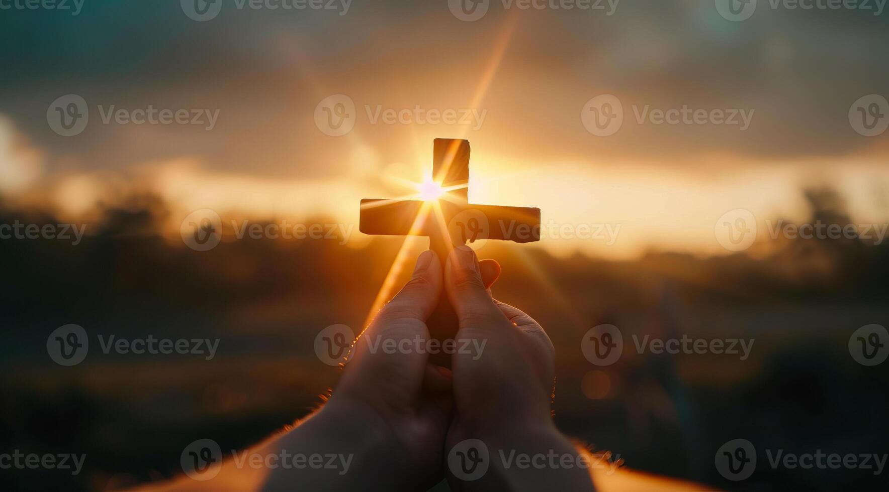 Person holding a cross. Concept of Christian faith and devotion to god and love to Jesus Christ photo