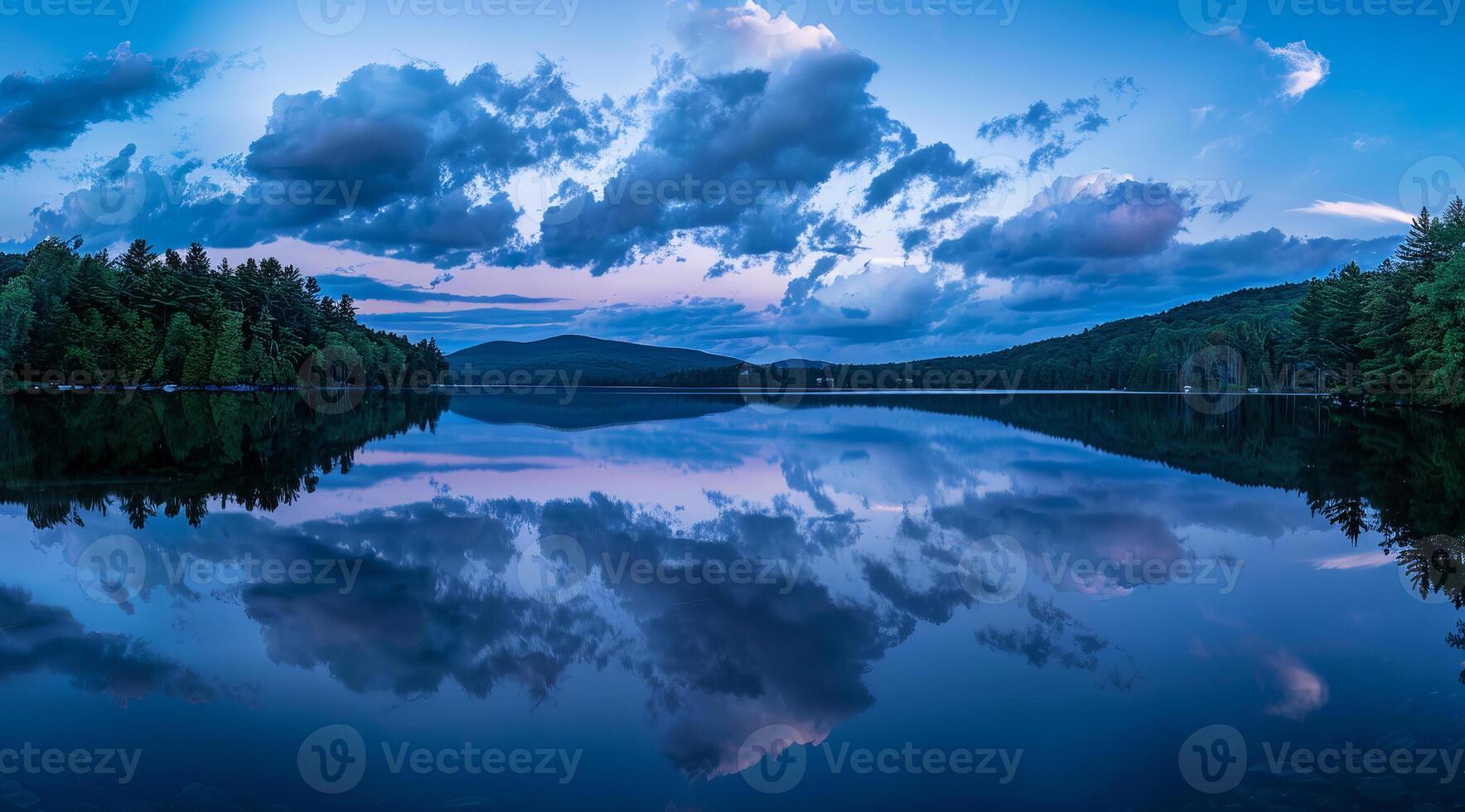 Serene lake dramatic landscape and skies on sunset or blue hour photo