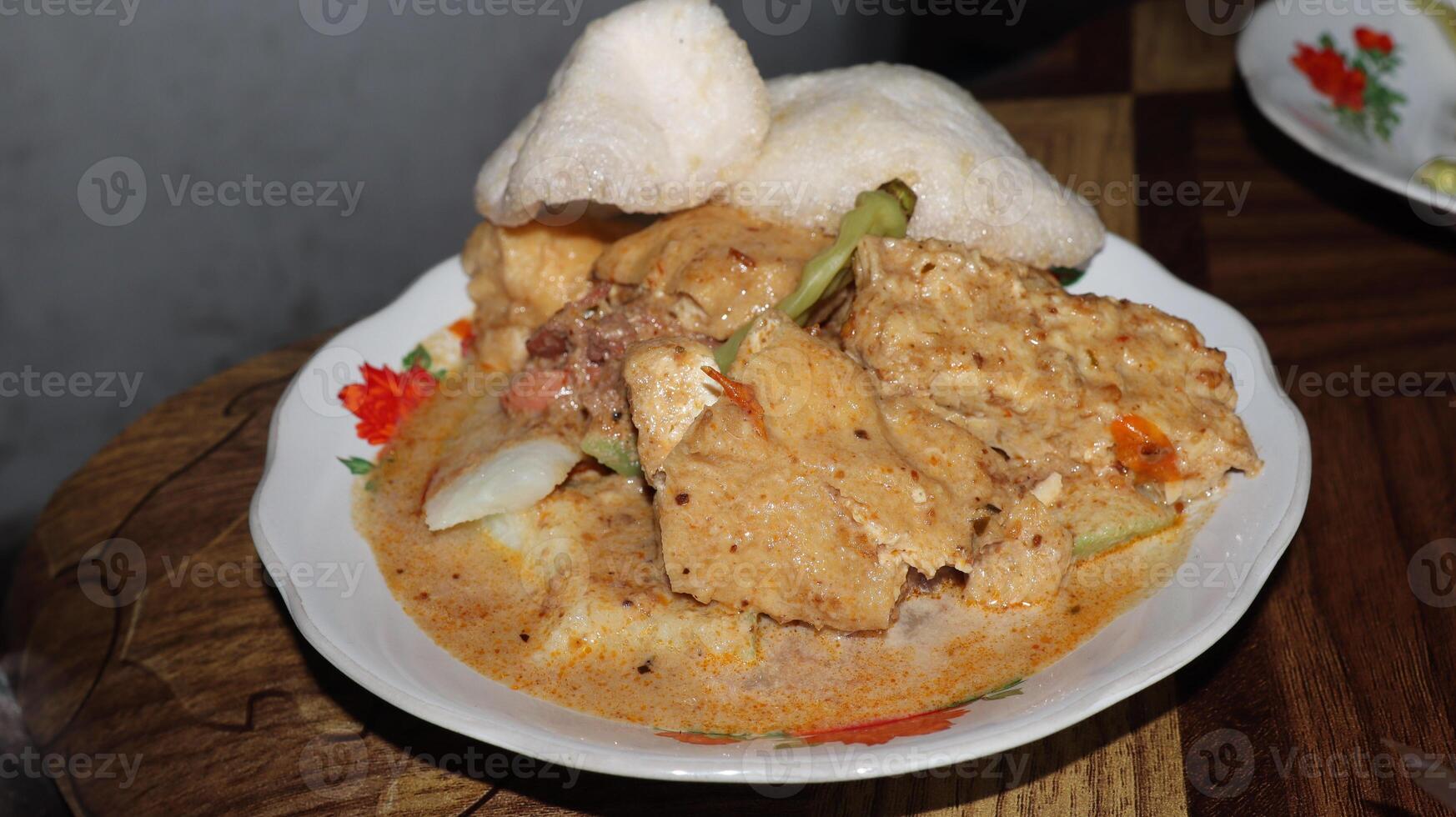 Lenthog Tanjung, a dish made from pieces of lontong, jackfruit, tempeh and tofu photo