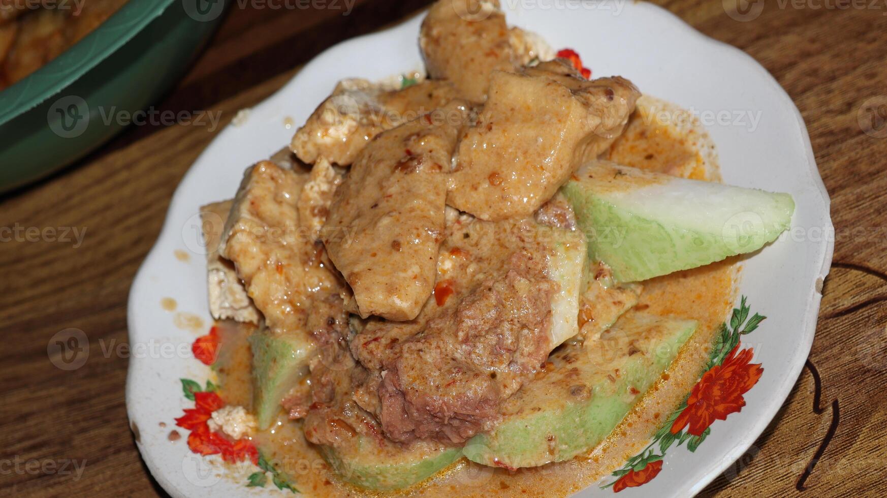 Lenthog Tanjung, a dish made from pieces of lontong, jackfruit, tempeh and tofu photo