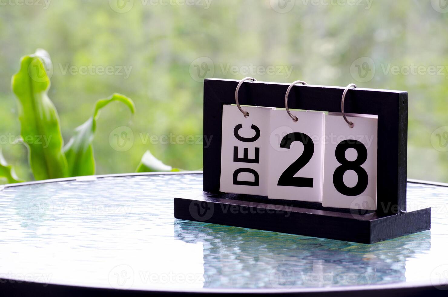 28 December calendar on marble table with customizable space for text. December calendar concept photo