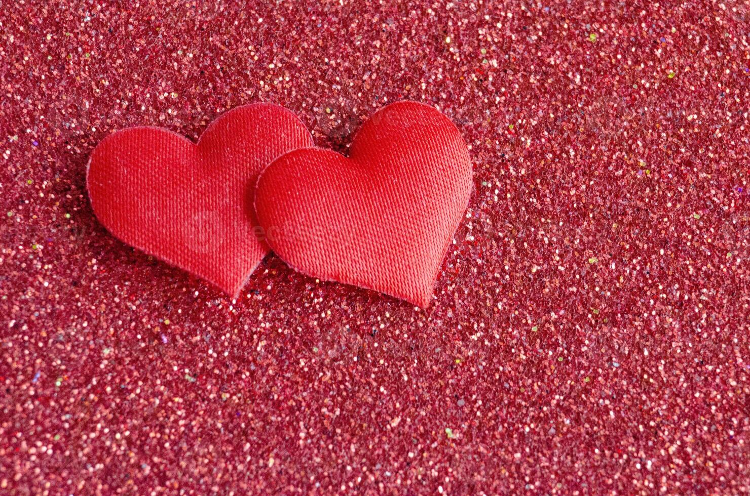 Top view of heart shapes on red color cover with customizable space for text photo