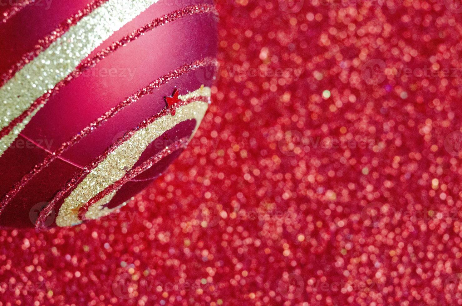 Close up view of Christmas ball on red background with customizable space for text or for wishes. Christmas celebration concept photo