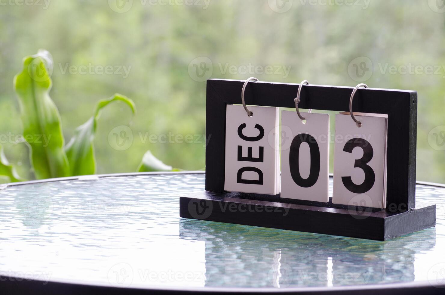 3 December calendar on marble table with customizable space for text. December calendar concept photo