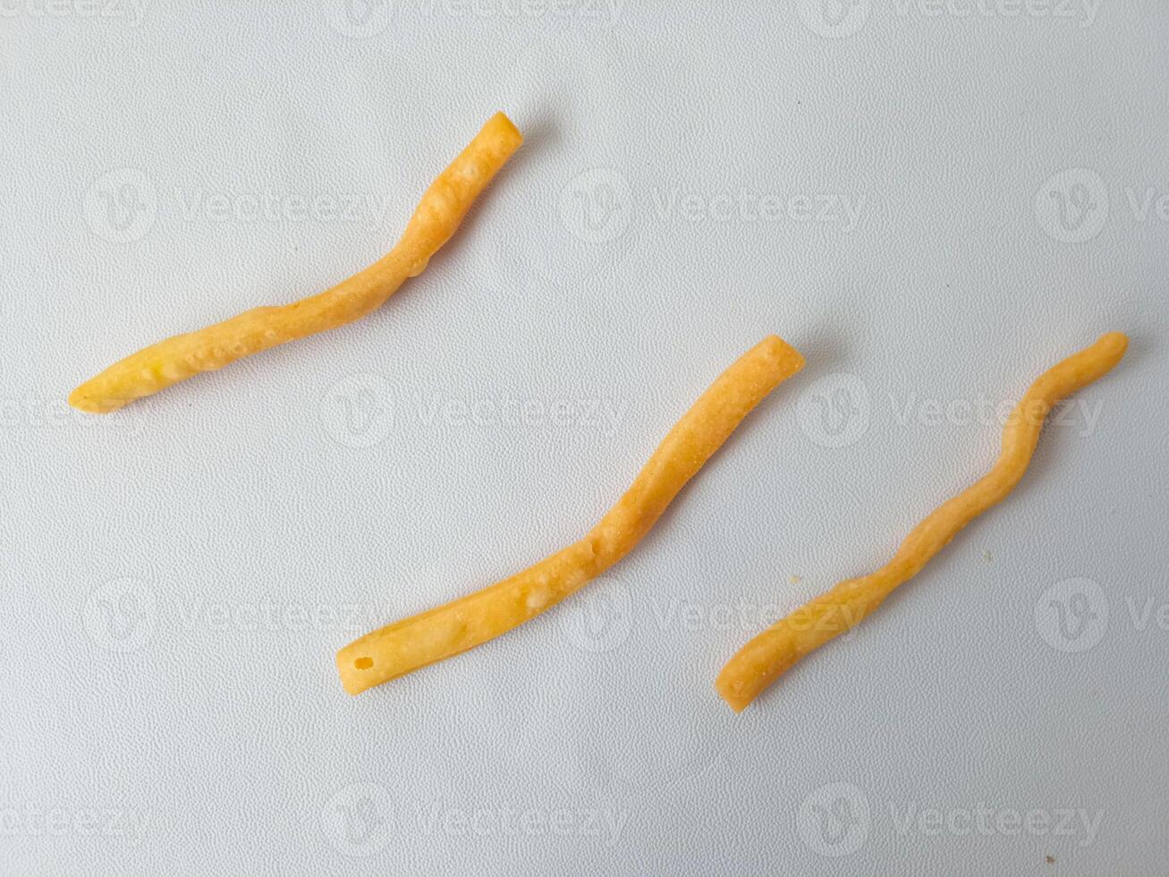 onion stick snack, delicious snack on plate isolate on white background. photo