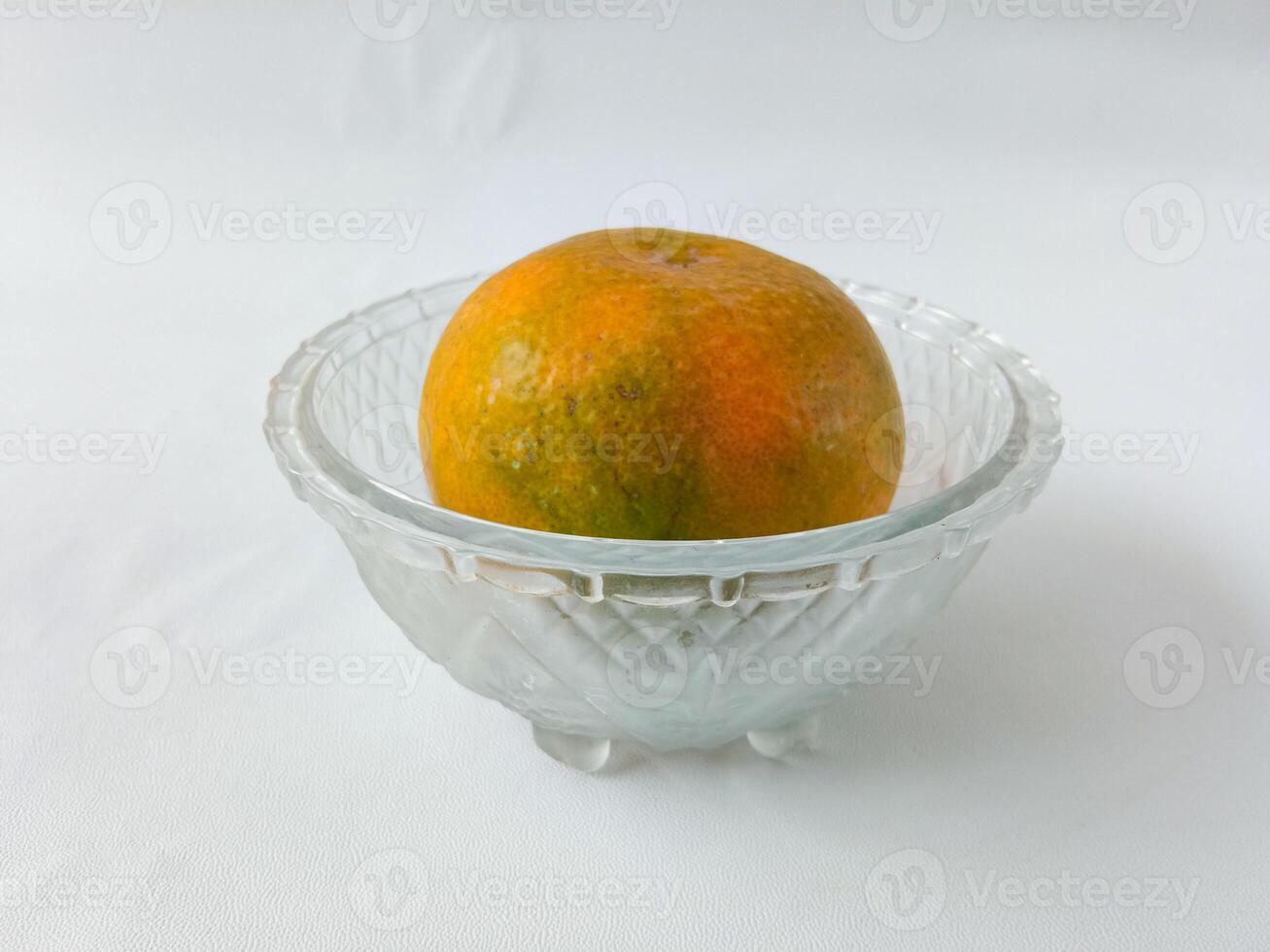 orange fruit on plate isolate on white background photo