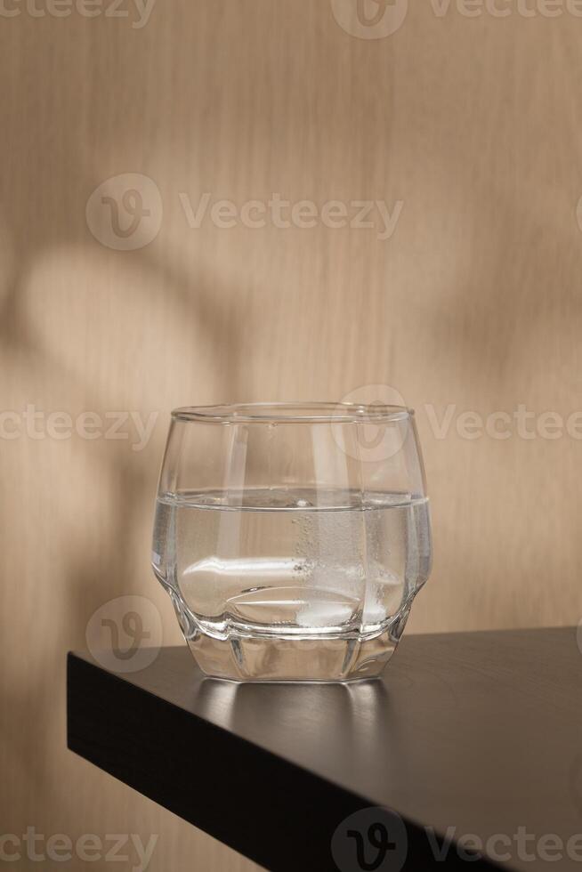 Effervescent mucolytic tablet dissolves in water. photo
