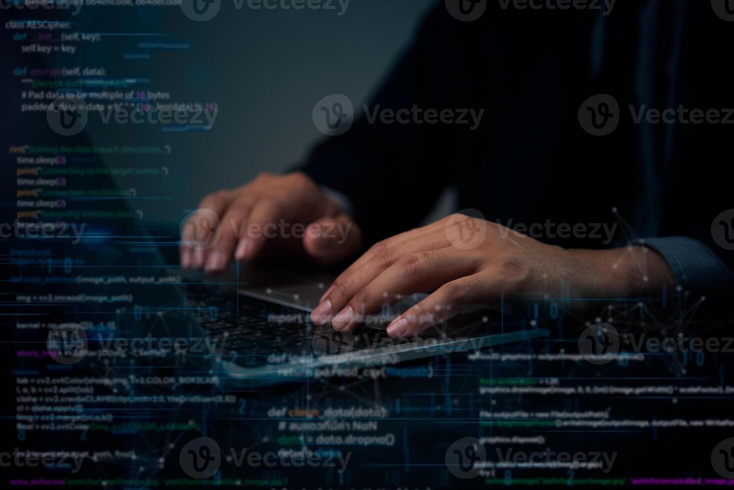 A person typing on a laptop computer with code on the screen photo