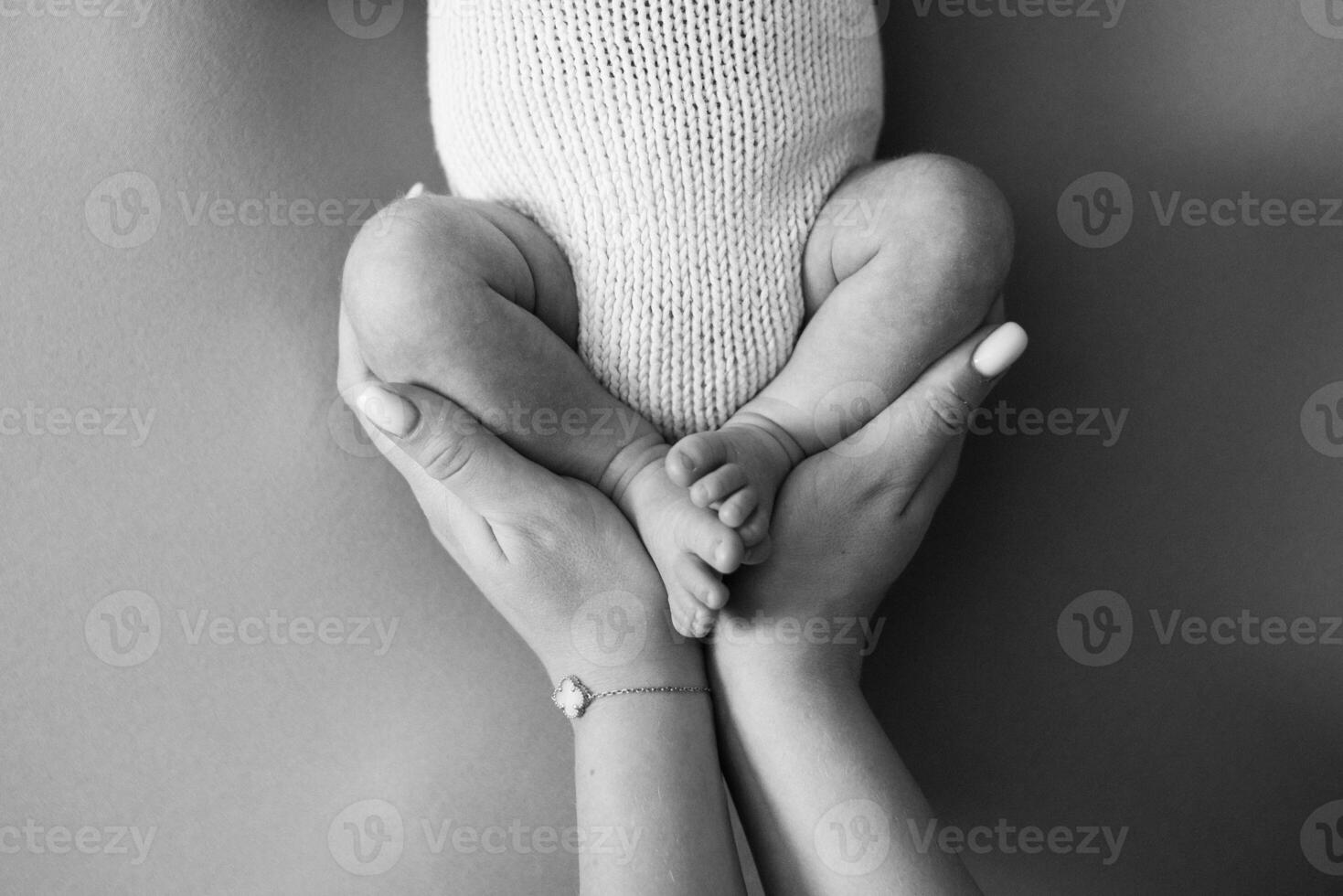 A black and white photo of a baby's feet