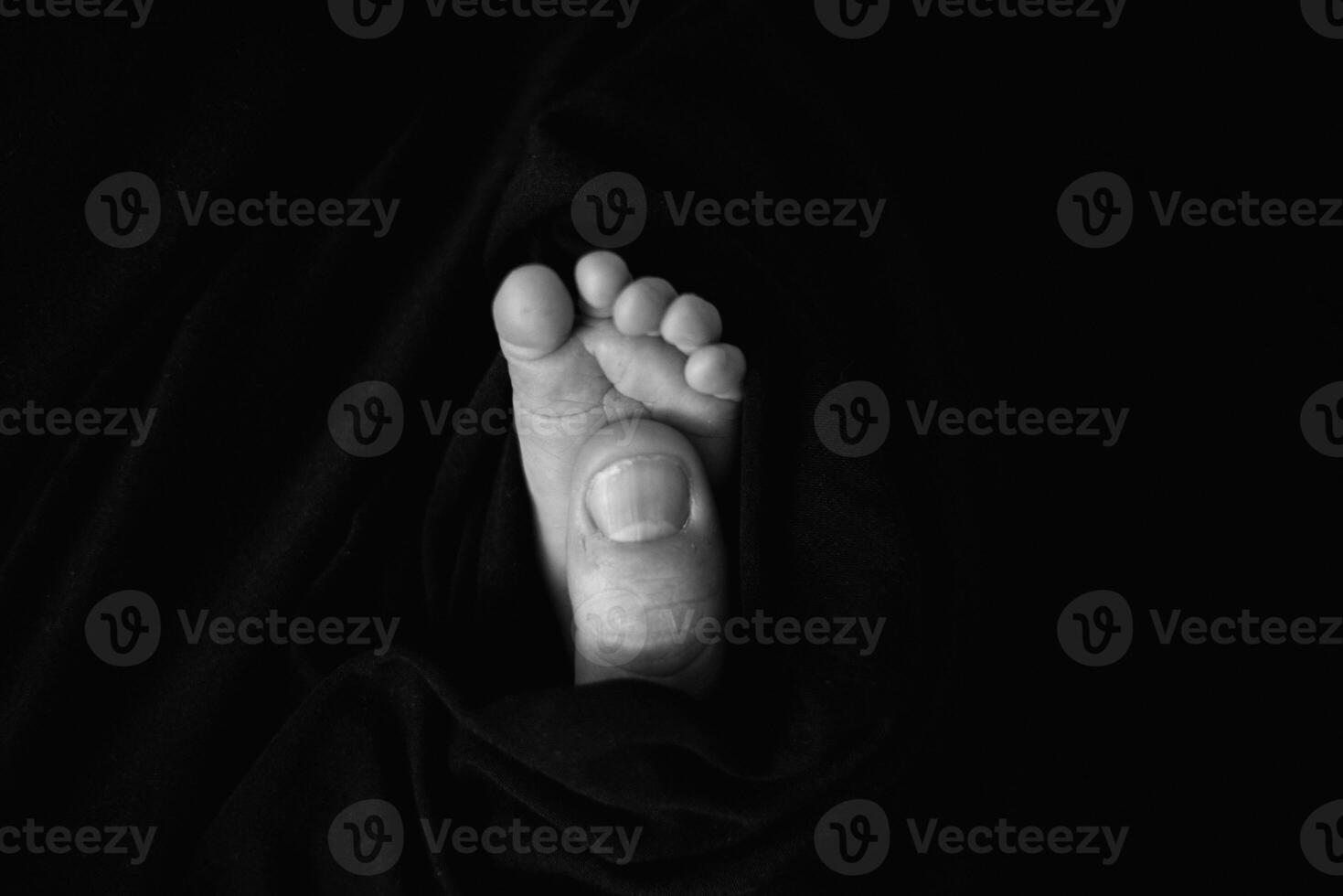 A black and white photo of a person's foot