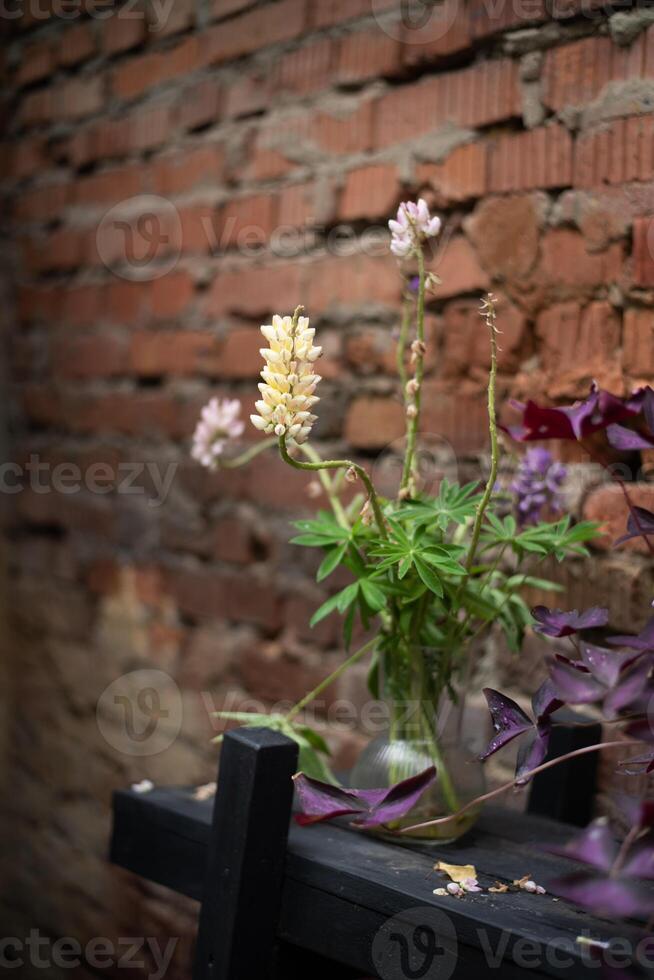 A vase of flowers sitting on a table photo