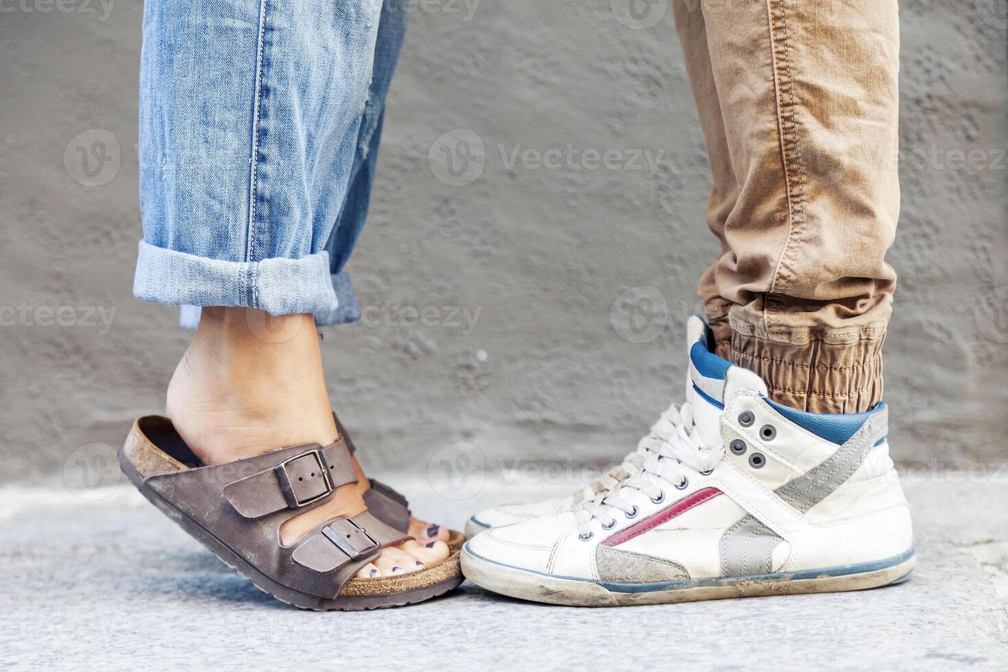 male and female legs meeting for kiss photo