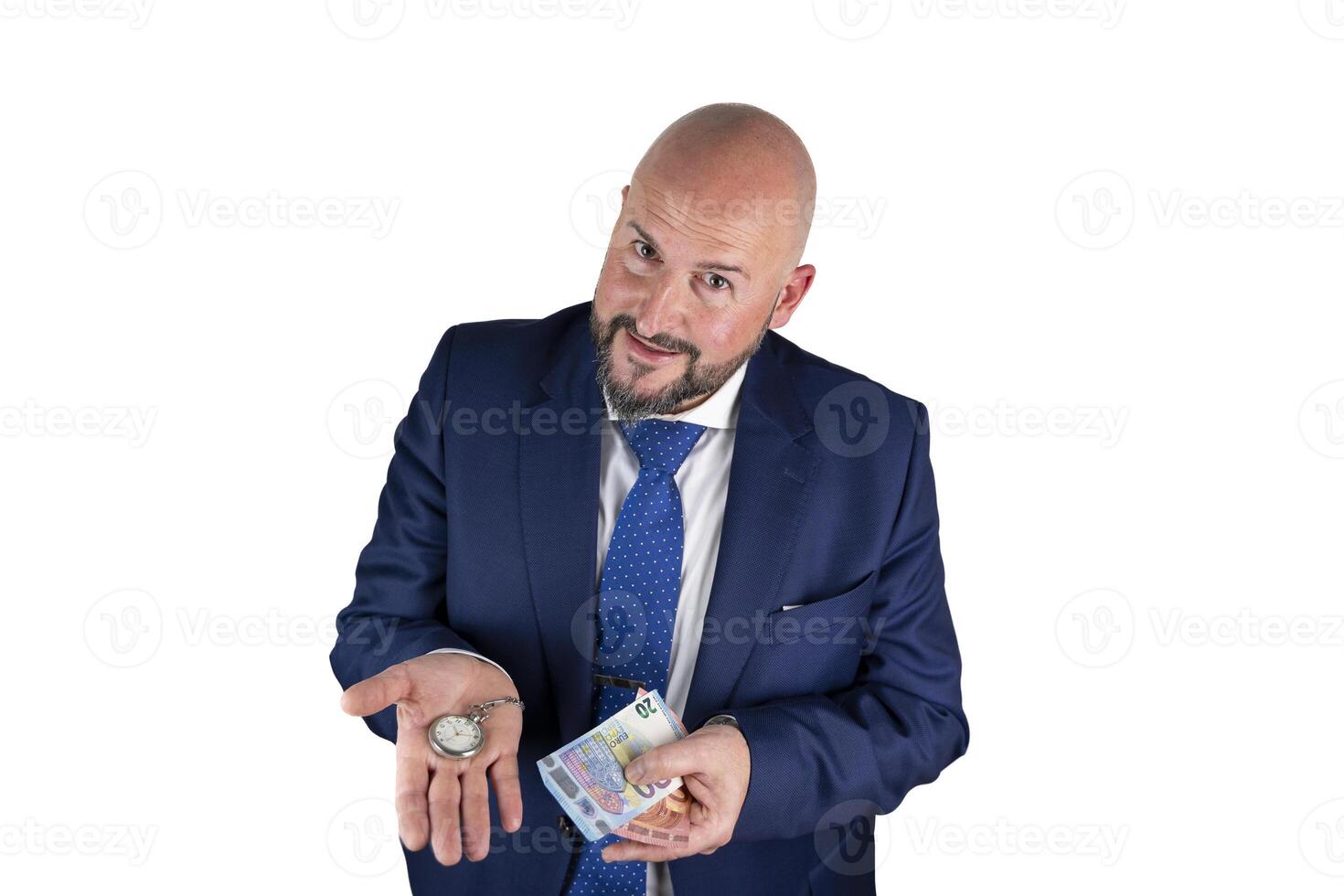 portrait of businessman in blue suit and tie with friendly expression showing a watch and banknotes isolated on white background photo
