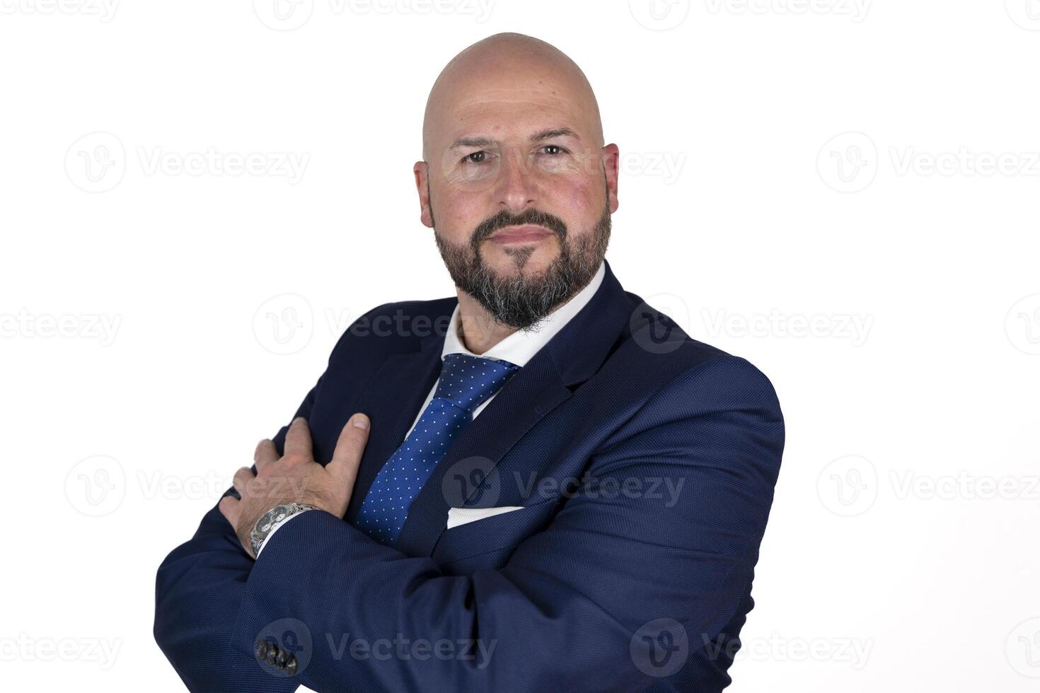 portrait of businessman in blue suit and tie with friendly expression isolated on white background photo