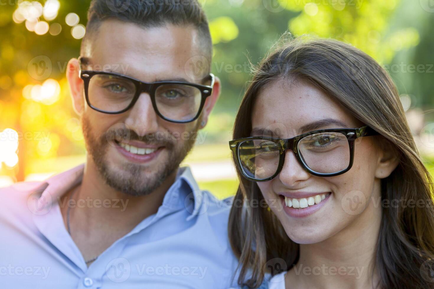 beautiful couple of young adults relaxing in the park photo