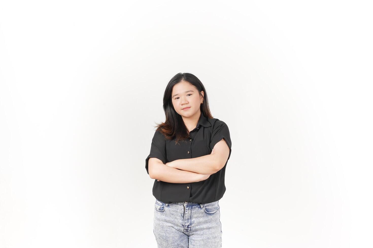 beautiful Asian woman stands with her arms folded across her chest, exuding confidence against a white background photo