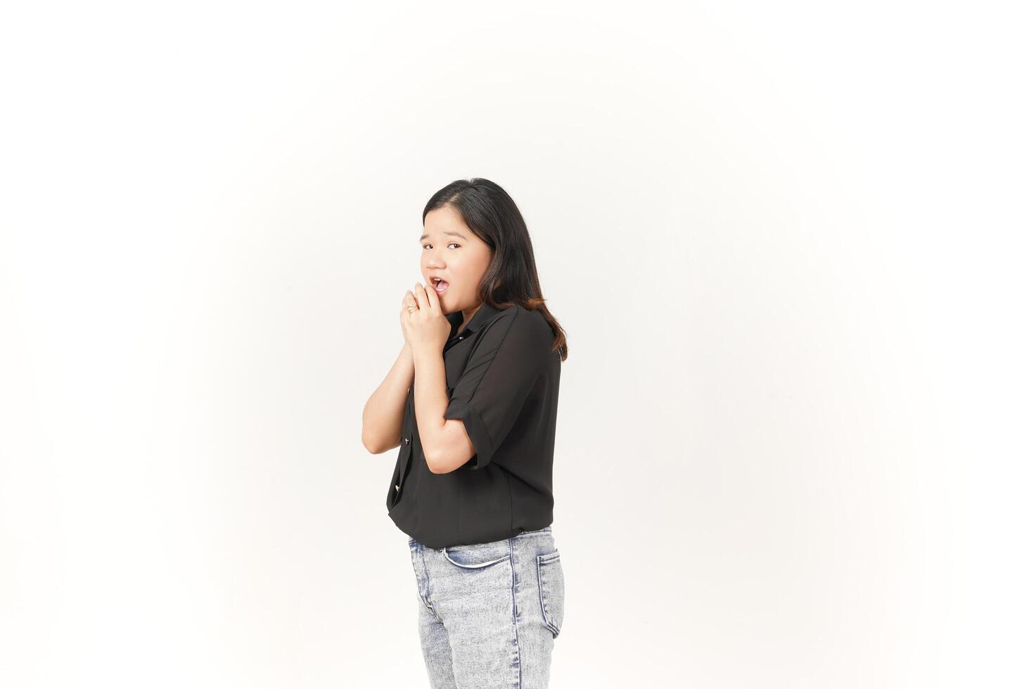 beautiful Asian woman looks scared, worried, and nervous, her expression full of anxiety against a white background photo
