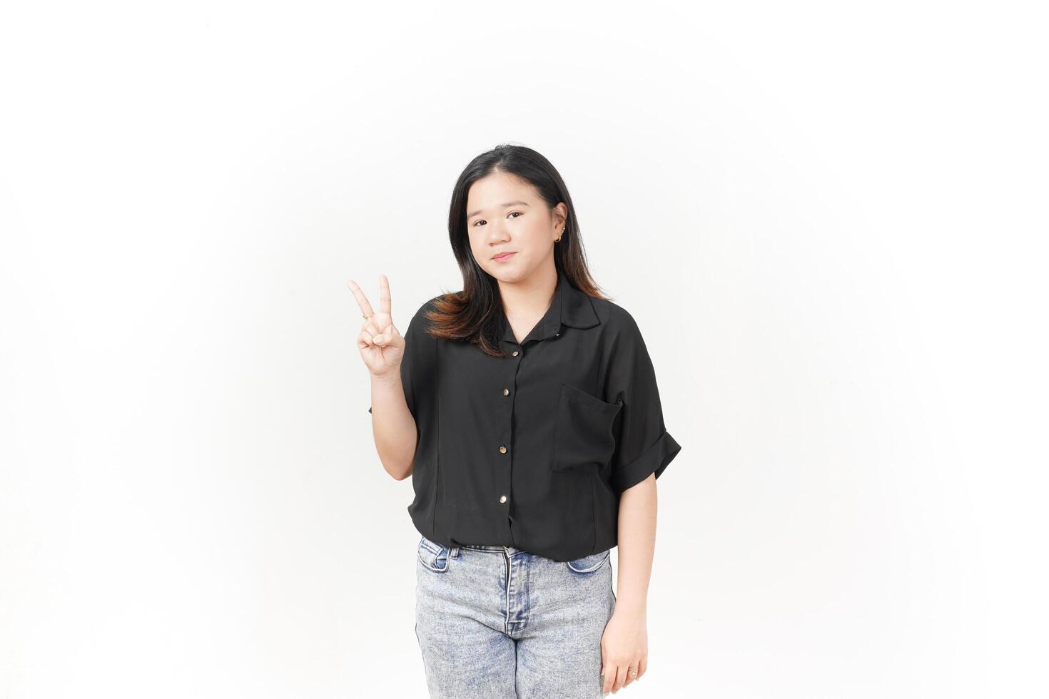 beautiful Asian woman poses with her hands to display the number 2, set against a white background photo