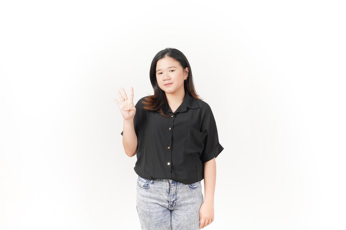 beautiful Asian woman poses with her hands, clearly showing the number four against a white background photo
