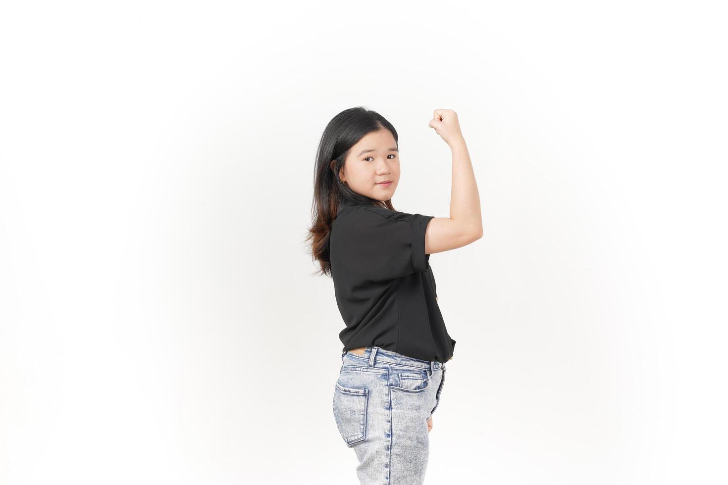 beautiful Asian woman strikes a bodybuilding pose, raising her arms confidently against a white background photo