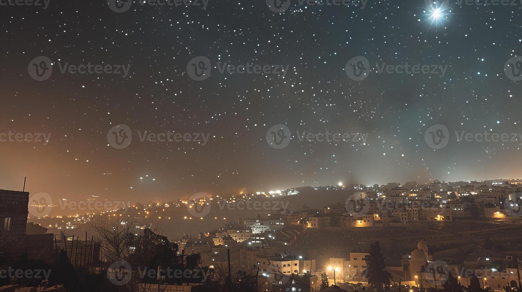 A city at night with a star filled sky above it photo