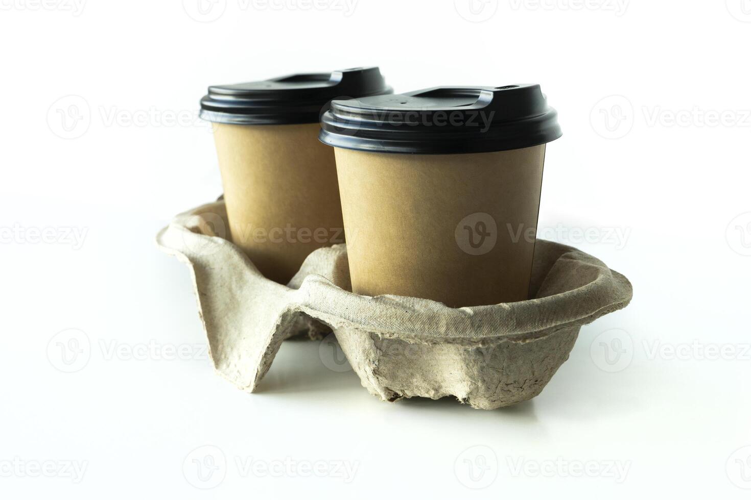 Takeaway paper coffee cups with plastic lids and cardboard holder in cardboard holder on white background, eco friendly, biodegradable photo