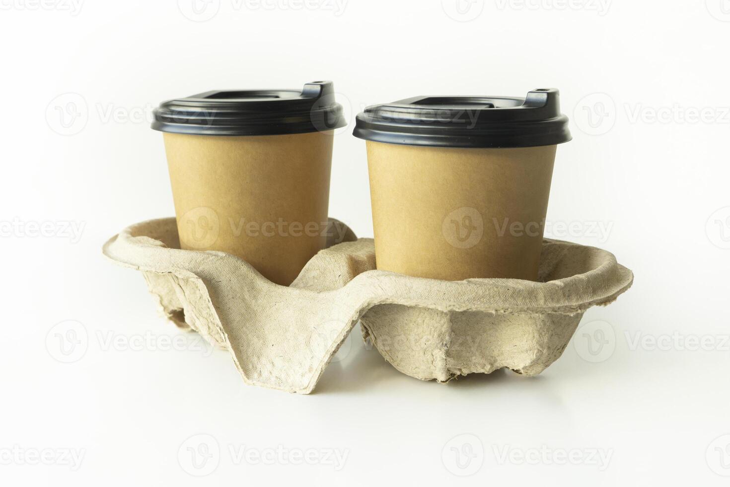 Takeaway paper coffee cups with plastic lids and cardboard holder in cardboard holder on white background, eco friendly, biodegradable photo