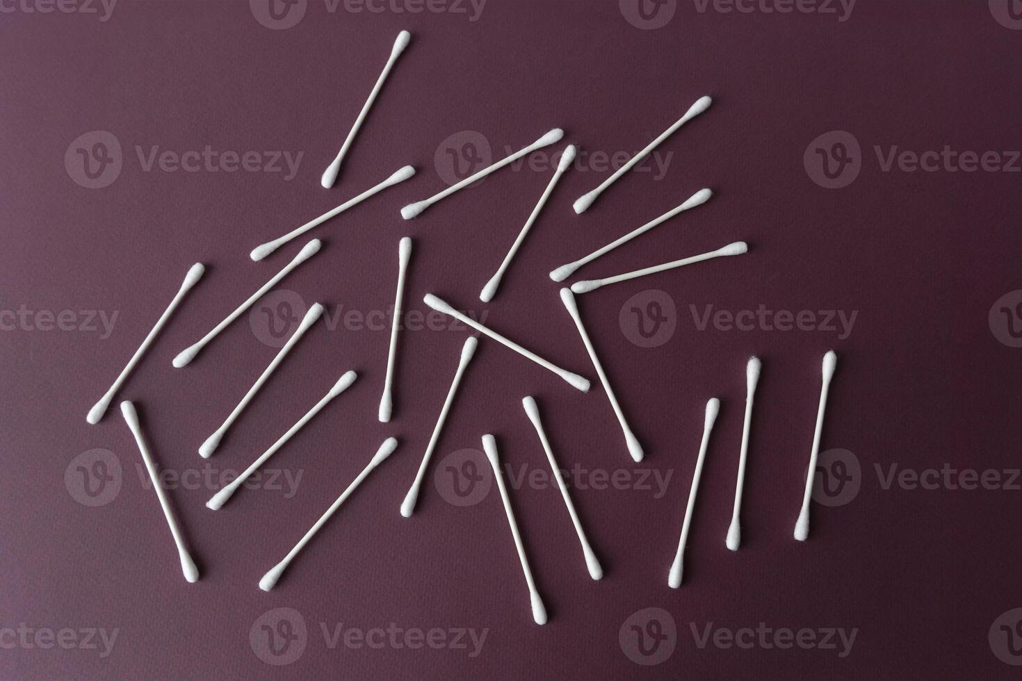 group of white Cotton ear sticks on dark background. Pattern, Ear care Concept, Makeup photo