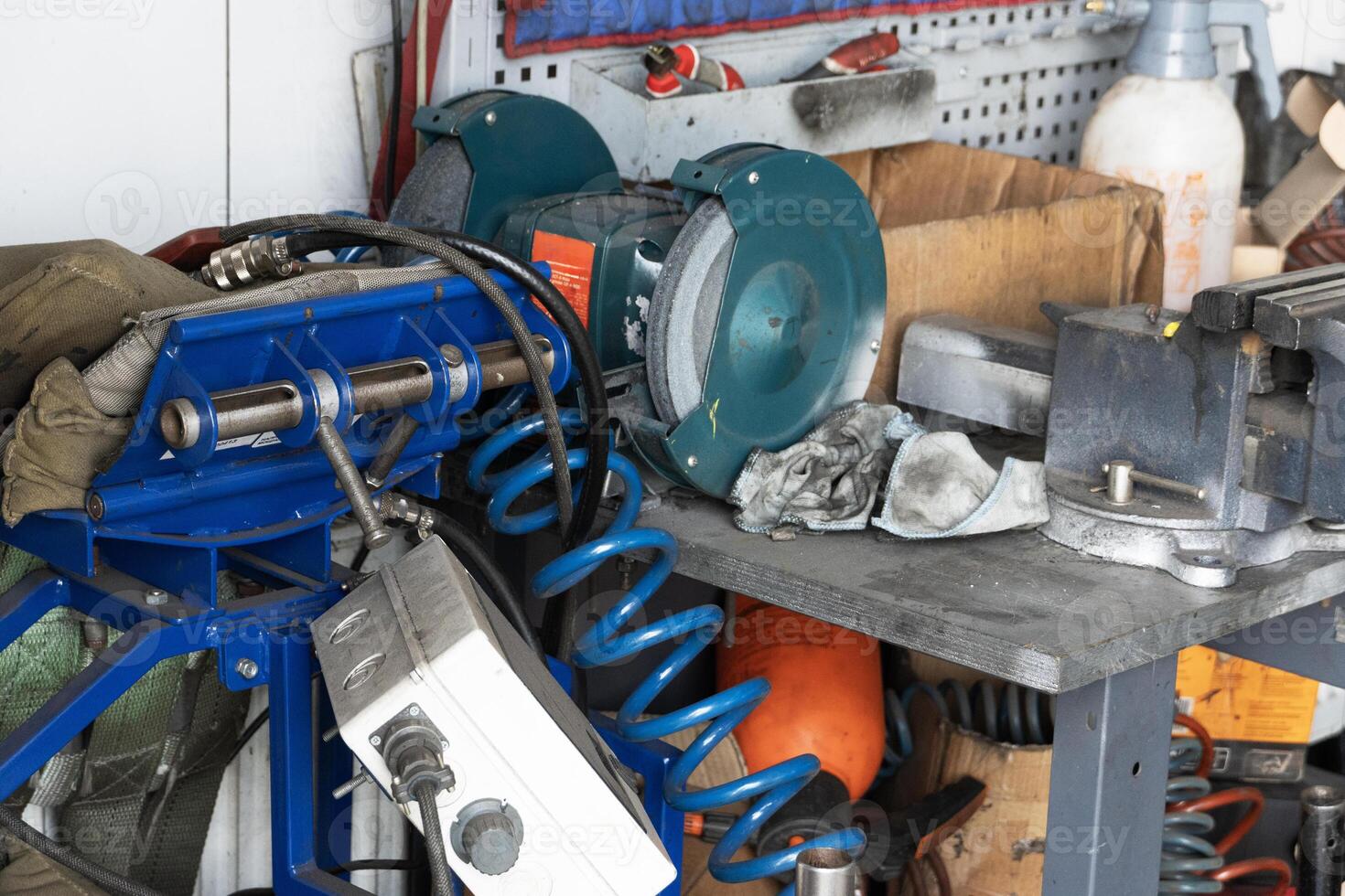 Mess on a working table with metallic tools photo