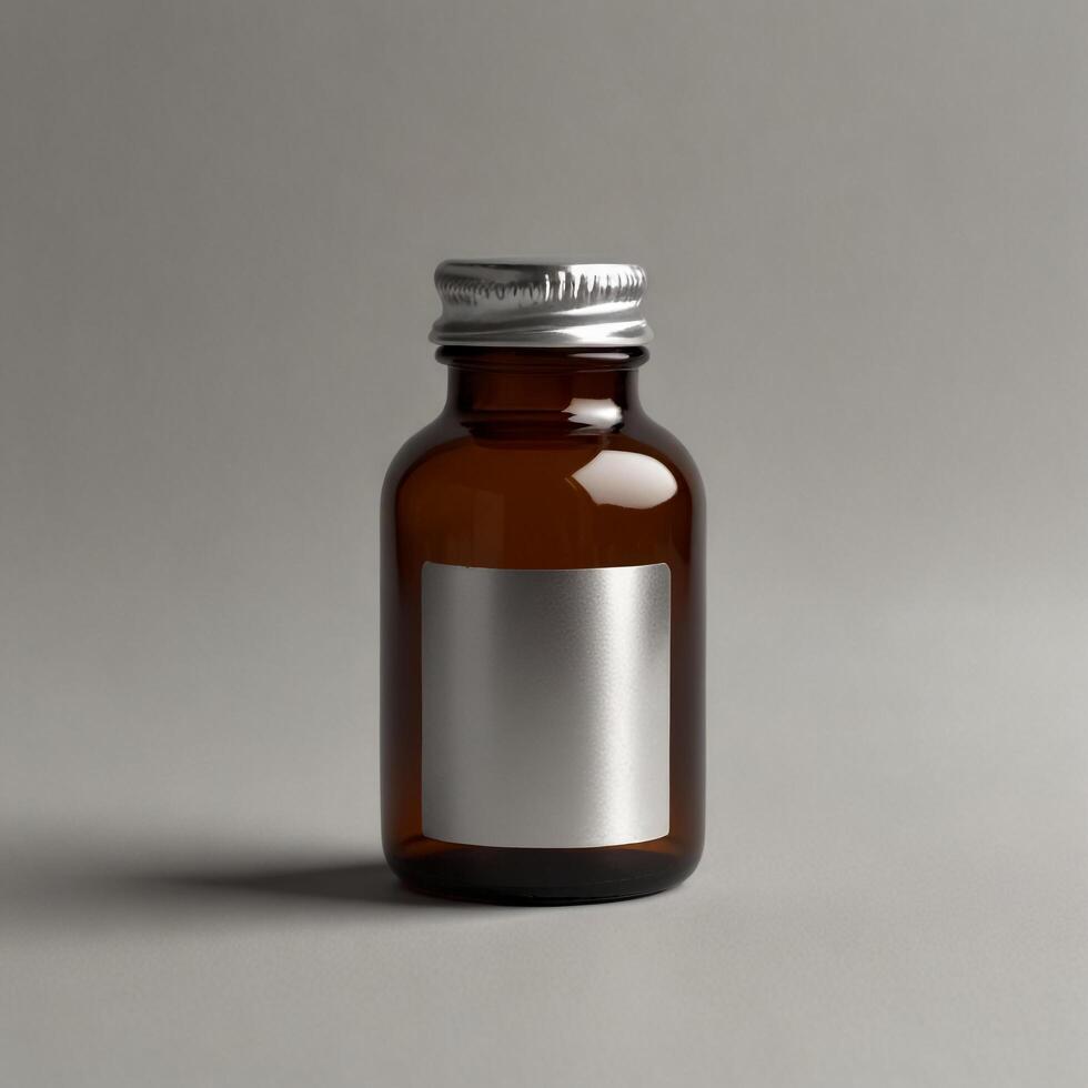 A small bottle of liquid on a gray background photo