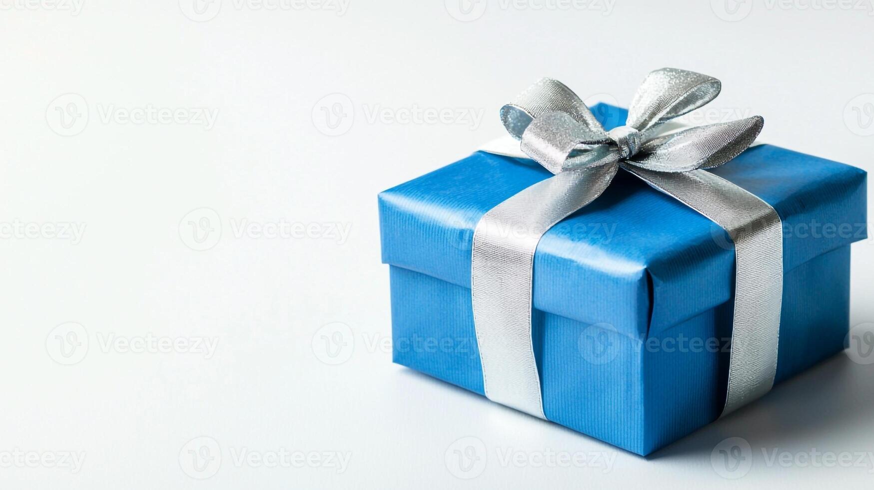 Blue gift box with silver ribbon on white background photo