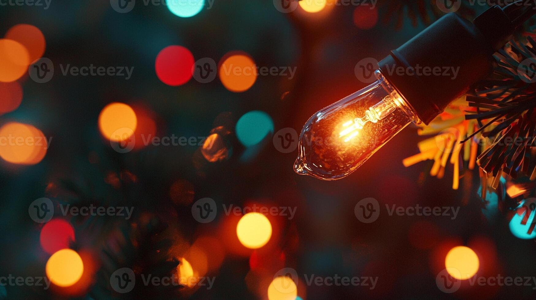 A light bulb is shining on a christmas tree photo