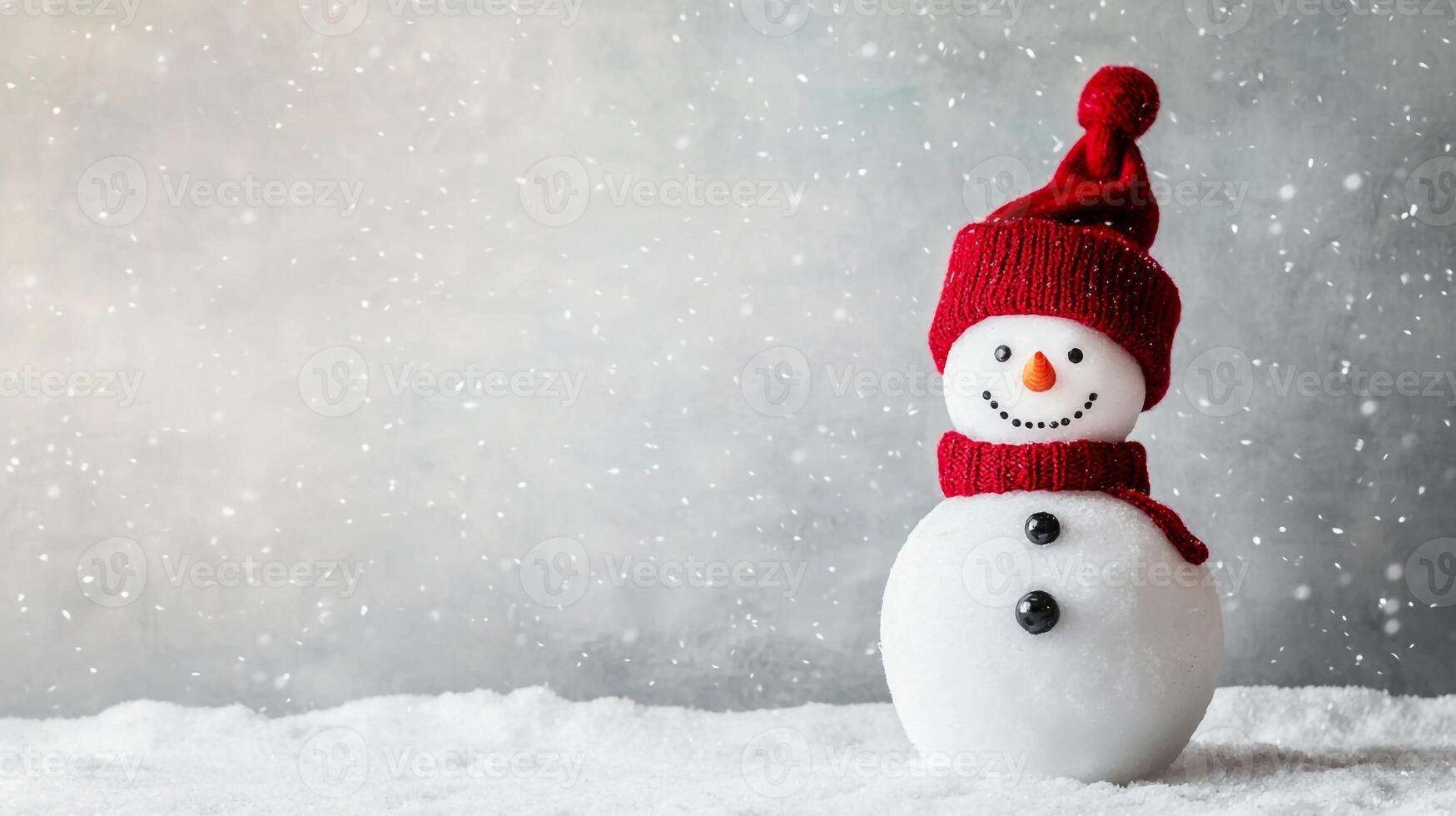 A snowman wearing a red hat and scarf photo